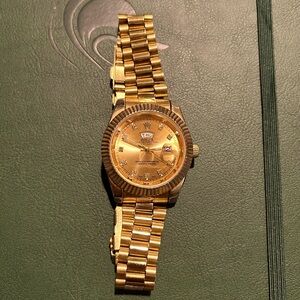 Gold UA rolex day date. Needs battery. No box